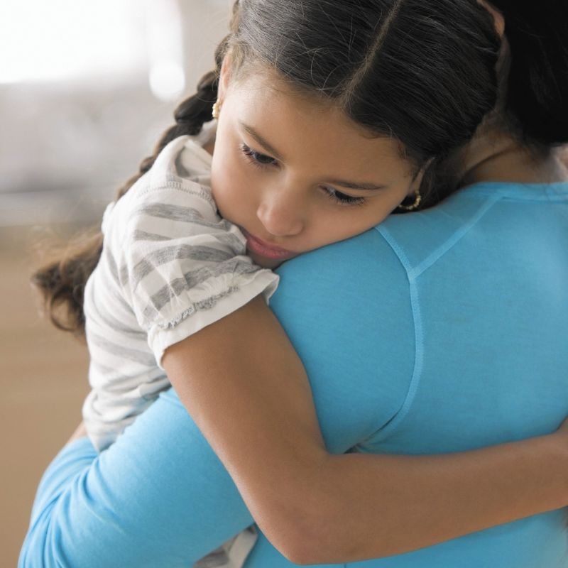 Mother comforting daughter