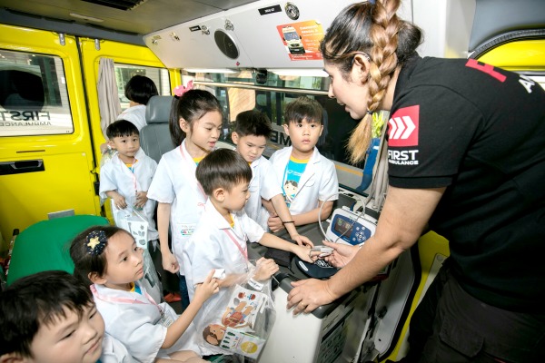 Dr. Little Club members check out the inner workings of an ambulance.