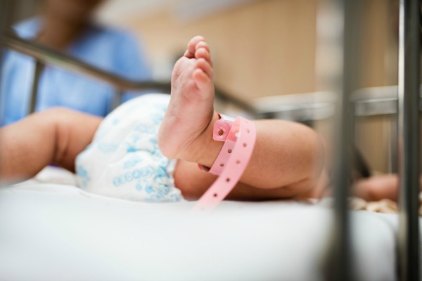 New born baby with tag. Diaper Hacks Make Life Easier