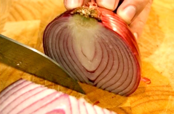 Cutting an onion. Peel Shallots, Onions, Ginger, Turmeric faster than you can say Save Time In The Kitchen