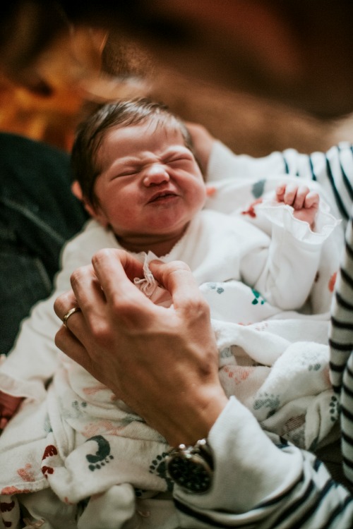 Funny screwed up face of baby. Crucial to Know: How to Burp a Baby