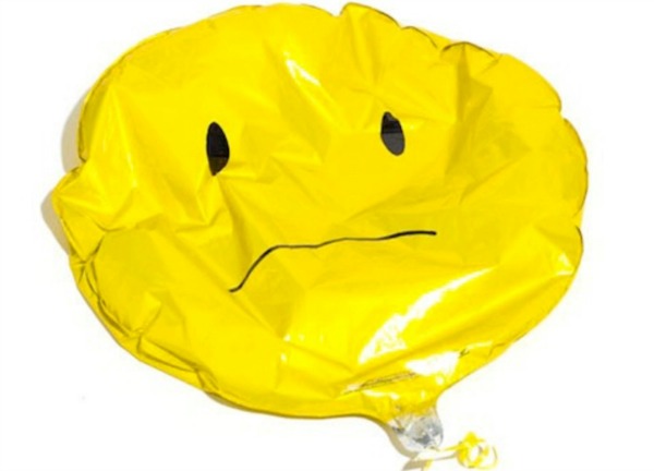 Deflated yellow balloon. 7 Things Nobody Tells You When You Stop Breastfeeding
