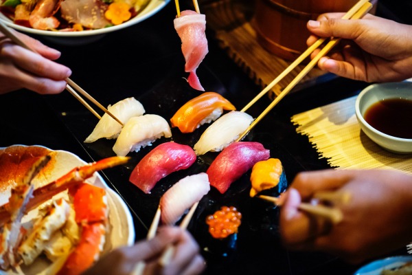 Many people eating a sushi meal. 7 Things Nobody Tells You When You Stop Breastfeeding