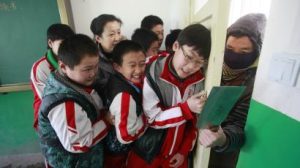 Boys Pushing Against A Door