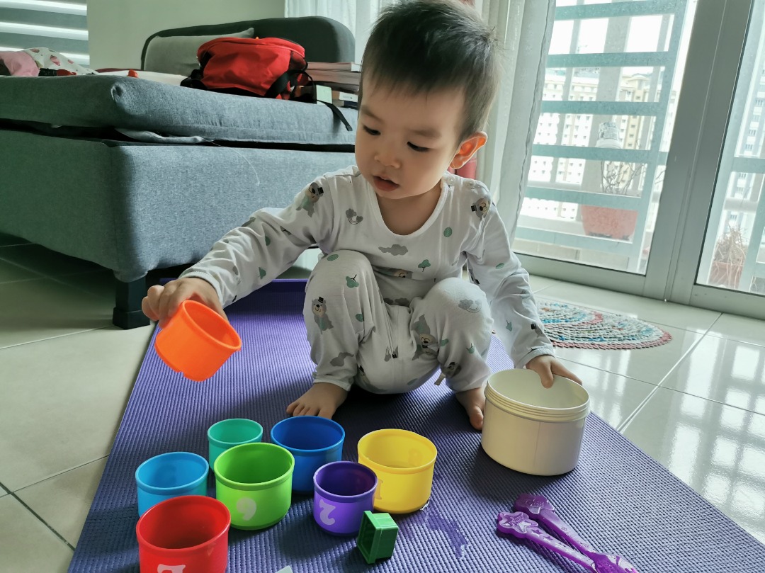 Child play on a yoga mat during his playtime. 