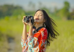 Woman Holding Camera