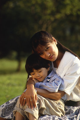 Mom Hugging Son - the reality of motherhood