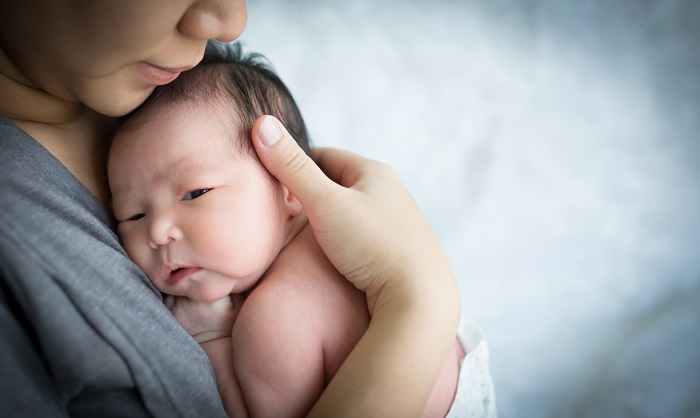 baby on mother's chest