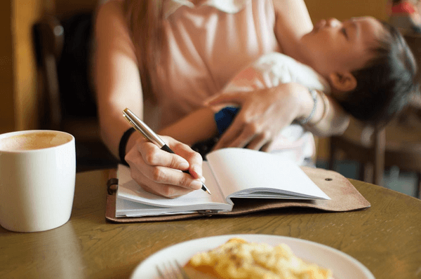 mother holding son - the struggle of motherhood