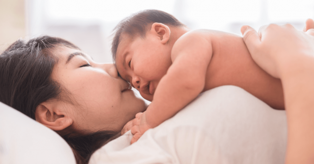 baby on a mother's chest 