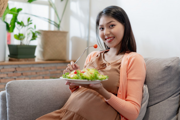 Pregnant Woman Eating Salad