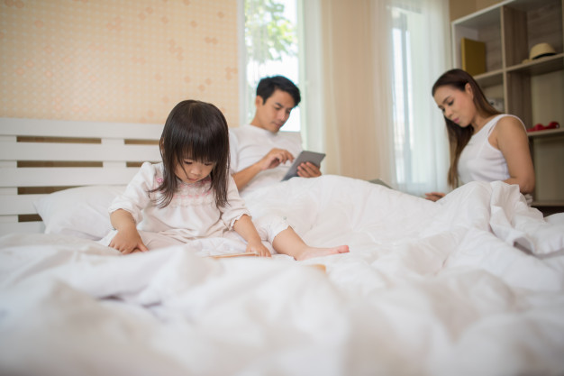 Family on gadgets ignoring each other