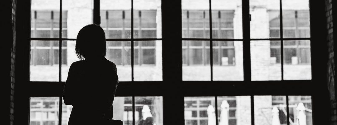 Woman Staring Outside Window