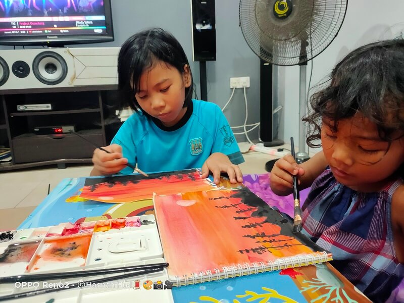 Nur Afia Qistina Zamzuri with her sister