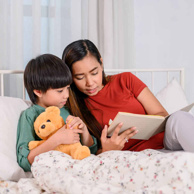 mom-reading-to-son