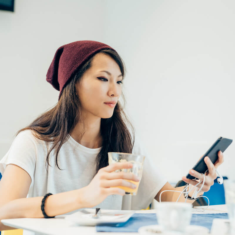 A lady scrolling through her social media