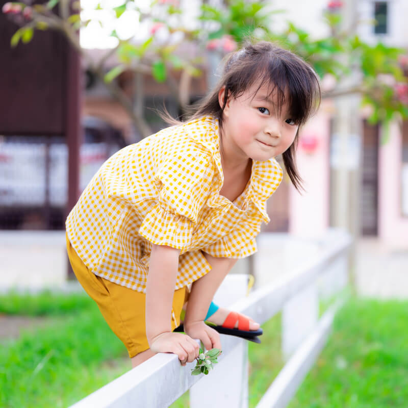 A girl going on the fence