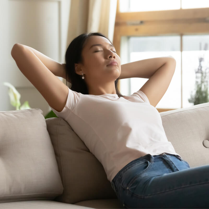 A lady relaxing on a couch