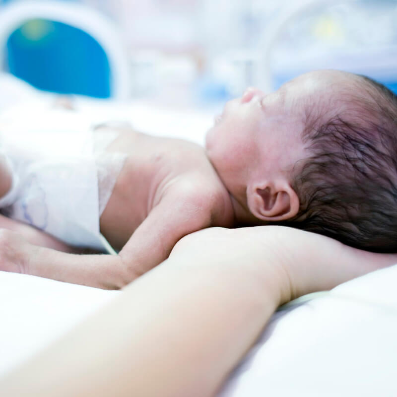 A premature baby on mums hand