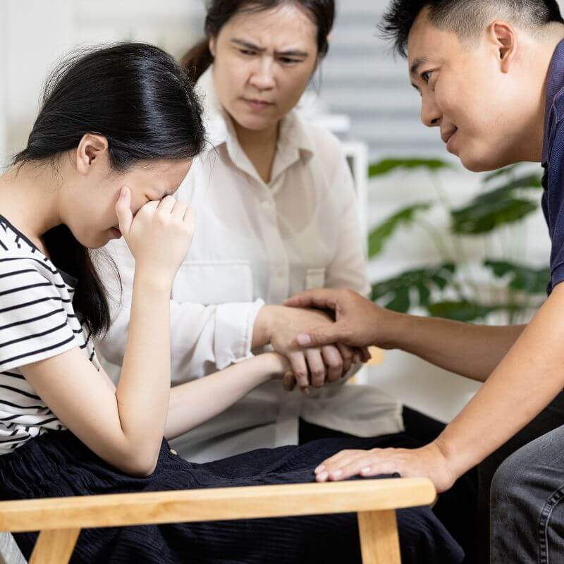 parents consoling child