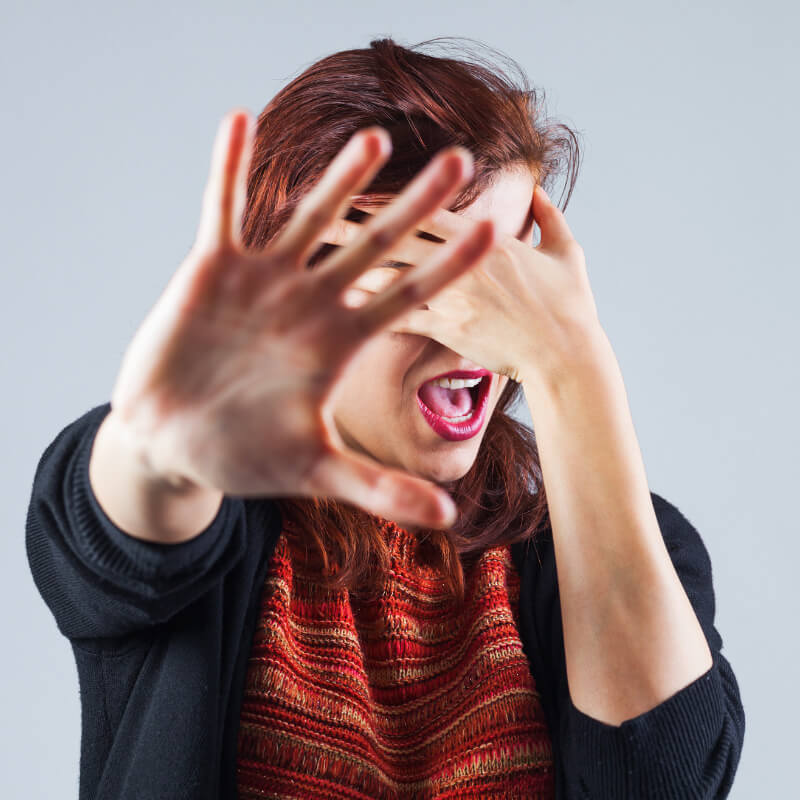 A lady covering her eyers