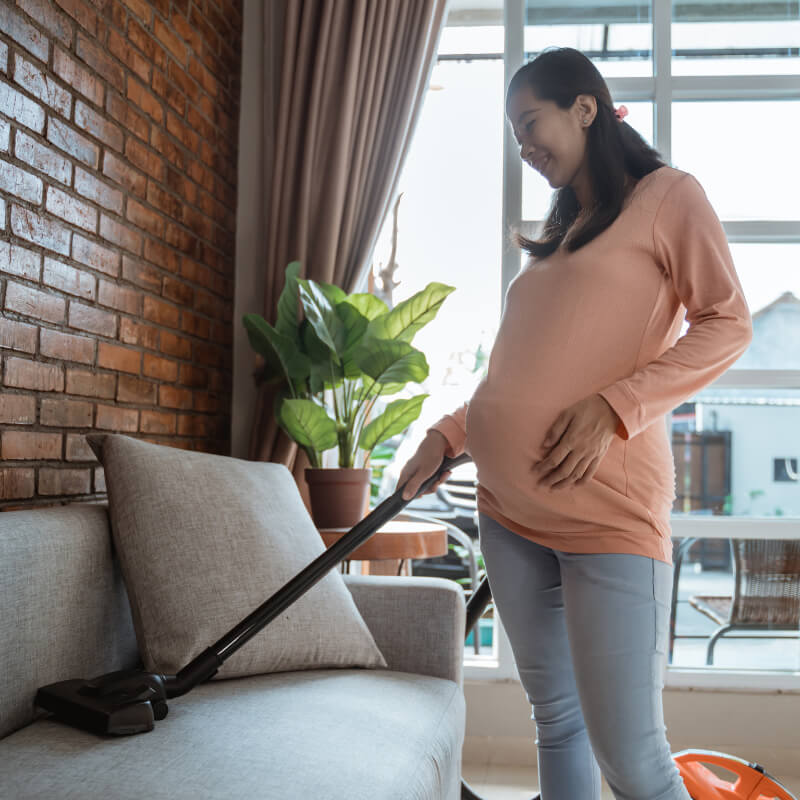 A pregnant mum cleaning