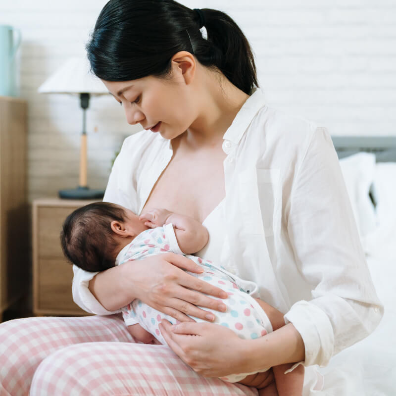 A mum learning to breastfeed