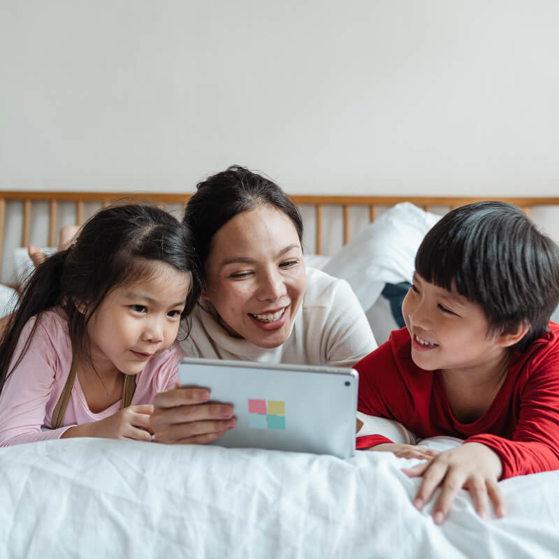 A mum watching video with her kids