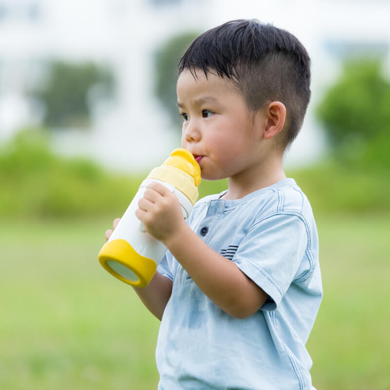 A boy drinking his water