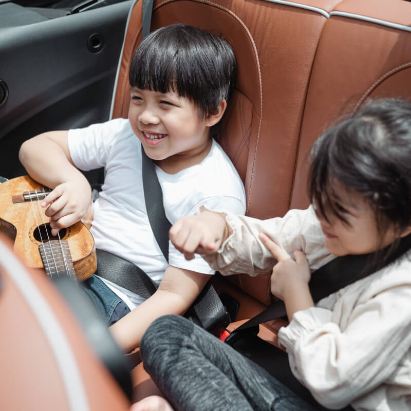 A girl and a boy in a car