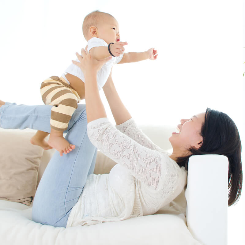 A mum playing with her baby