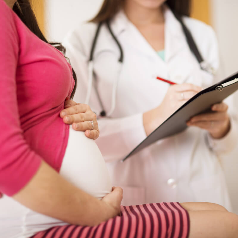 A pregnant lady getting medical consultation