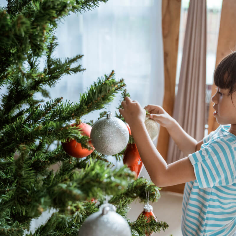 A girl with Christmas tree