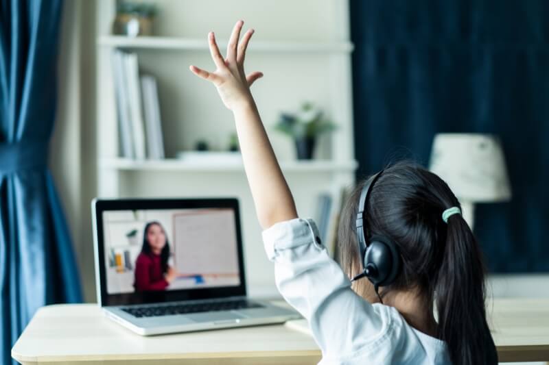 young girl distant learning