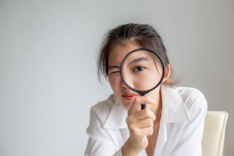 woman on magnifying glass