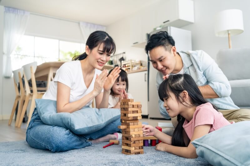 family playing jenga