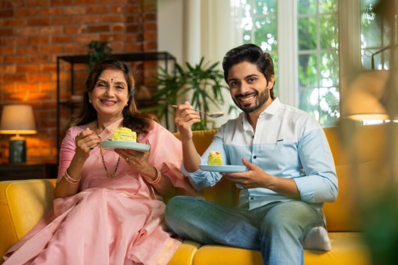 mum and son enjoying coffee and cake