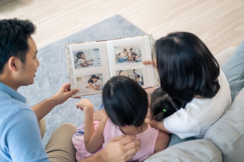 family looking at album